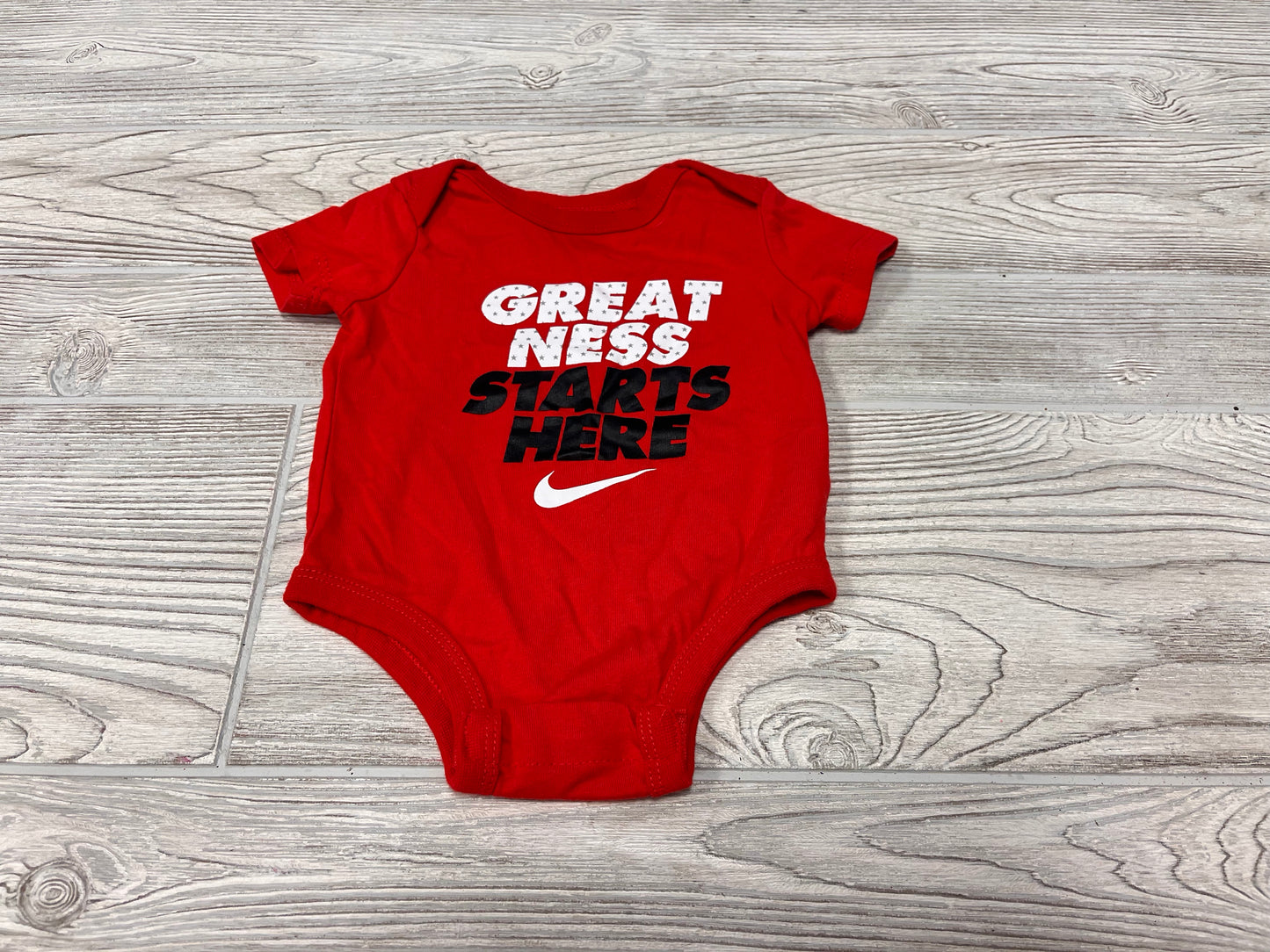 Nike “Greatness Starts Here” Short Sleeve Onesie